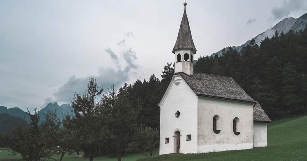 Small country church building on a cloudy day