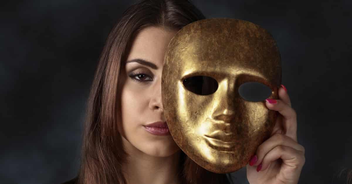 woman wearing a gold mask at halloween