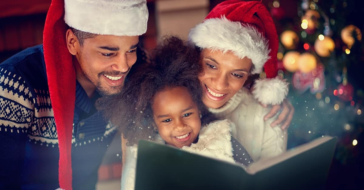 Black family reading Christmas story