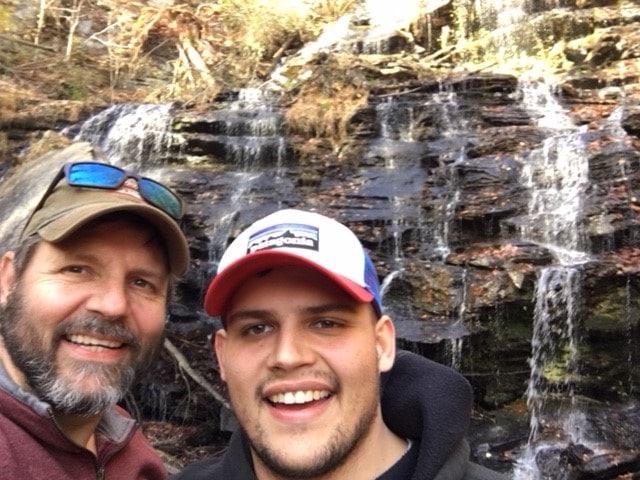 Joseph Drolshagen and his father at a waterfall